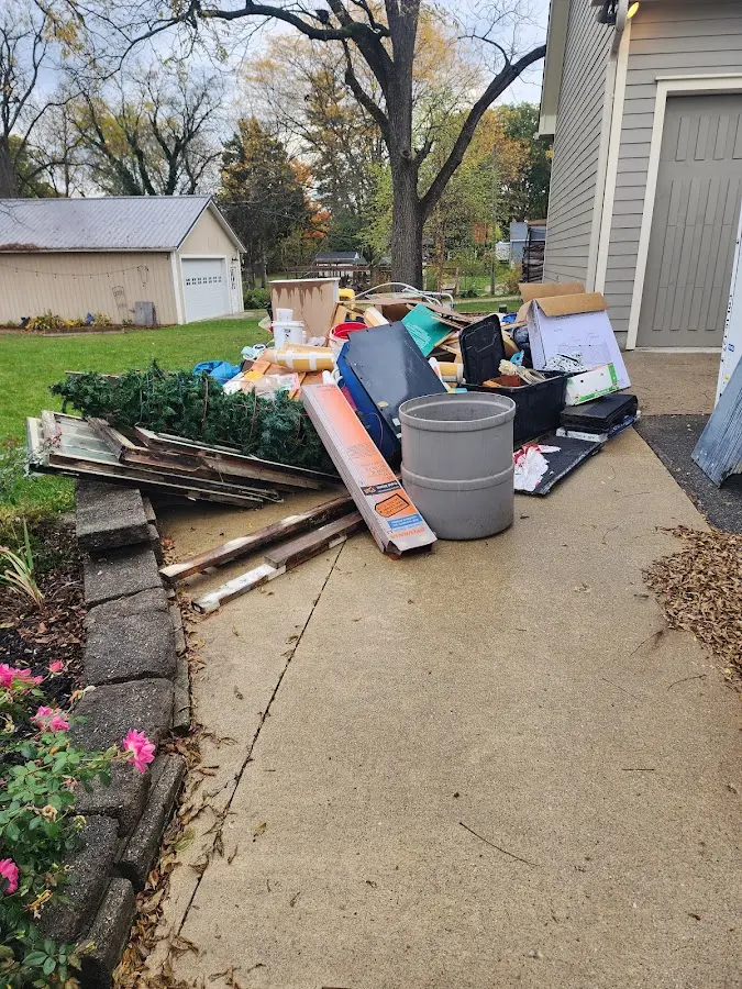 Dumpster being loaded with debris for Commercial Dumpster Rental in Clarcona